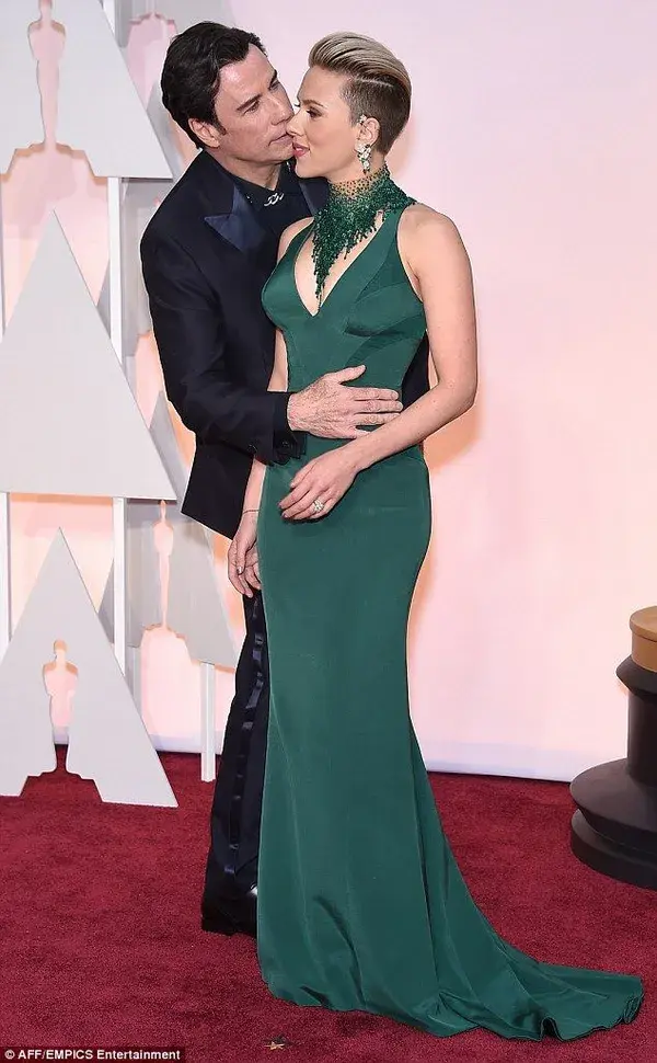 Scarlett Johansson gets a surprise kiss from John Travolta