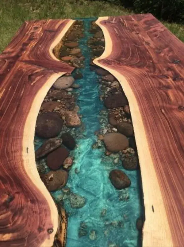 This Live Edge River Dining Table has Stones along the Banks