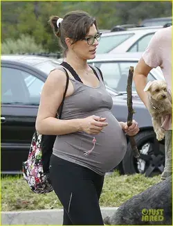 Pregnant Milla Jovovich proudly displays her burgeoning bump on a hike 2023