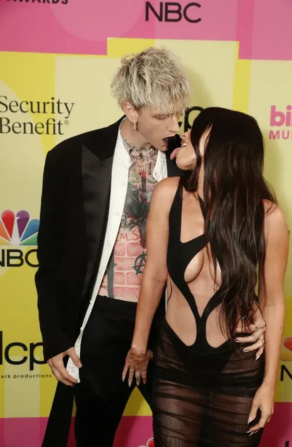 Megan Fox grabs boyfriend Machine Gun Kelly’s privates on Billboard Awards red carpet in very revealing cut-out dress