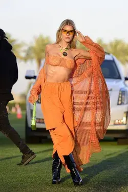 Joy Corrigan in orange at Coachella  (April 2023)