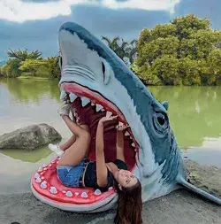 Pretty girl getting eaten by a shark