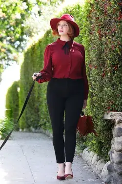 Christina Hendrix in burgundy button-up and black pants