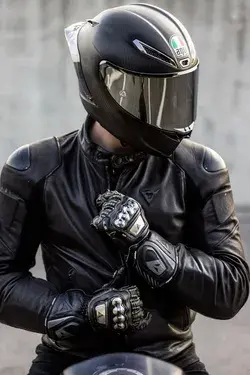 Biker in a Cool AGV Carbon Fiber Helmet and Dainese Leather Jacket