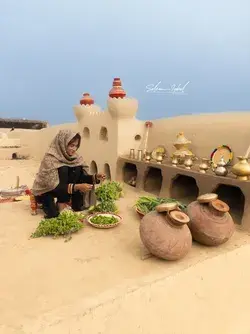 Village girl cooking Saag , a traditional recipe of Punjab