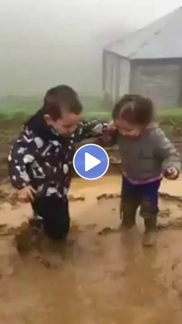 Kids having fun playing on the mud