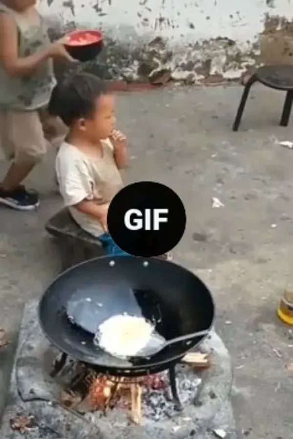 Kid feeding his brothers