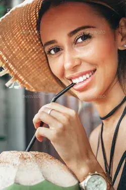 Young woman drinking coconut juice Stock Photo by JohanJK | PhotoDune