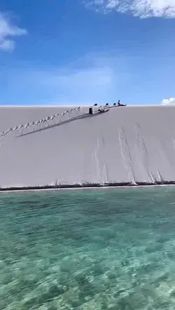 @lencoismaranhensestrekking rolls down the white sand dunes in 📍Brazil.