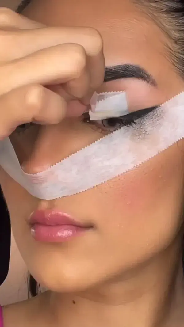 Tape eyeliner hack  Credits:@youngcouture