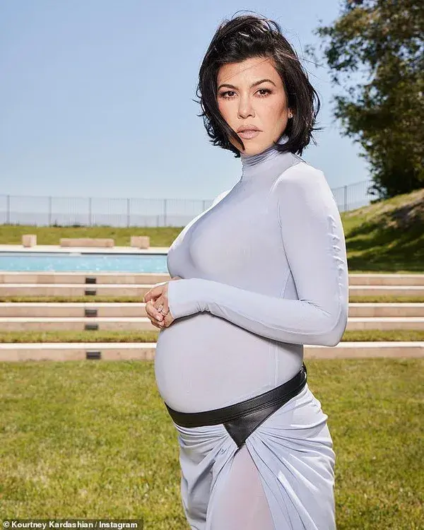 Kourtney Kardashian, 44, gives more glimpses at her baby bump as she turns to GOOGLE for advice a...