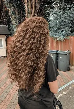 Long brown layered curly hair!