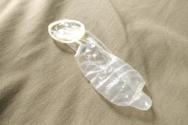 Used condom on the bed, Can prevent communicable diseases, AIDS, HIV, Human Immunodeficiency Virus.