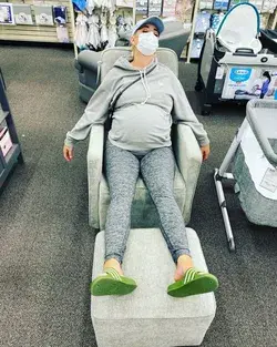 Katy Perry looks exhausted as she collapses in chair at baby supplies store ahead of due date