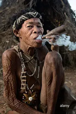 San bush woman smoking a pipe - Alamy Stock Photo