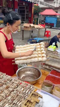 We’re in China watching this street vendor prepare spicy fermented tofu 🔥