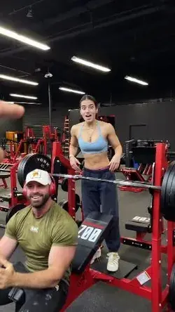 A cute girl helps to the man weight lifting 💪