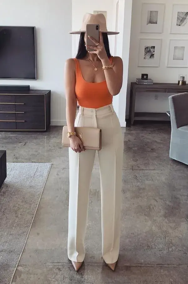 Orange Bodysuit + Cream high waisted, wide leg pants + nude heels + fedora