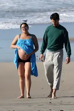 Gina Rodrigez Pregnant on the beach with Husband