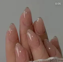 Light sparkly nude nails almond