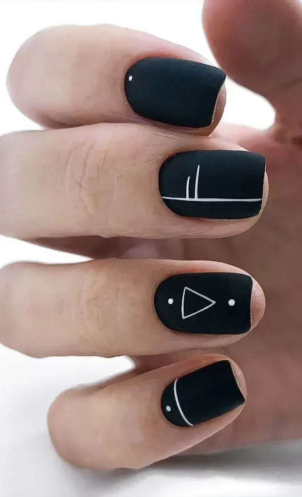 Black manicure with simple geometry