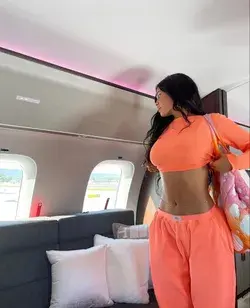 Kylie Jenner posing for Instagram picture on private jet plane