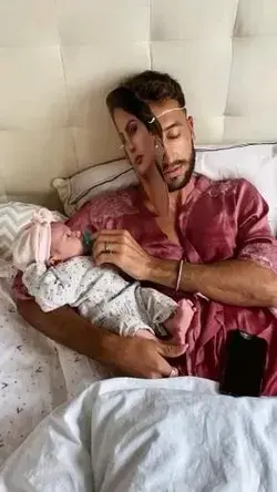 Dad pretends to be mom for newborn baby sleepy time