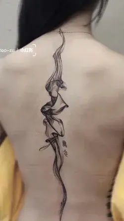 A curl of smoke rises from …. super artistic tattoo.