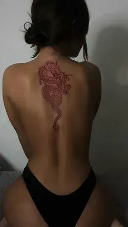 Red ink back tattoo