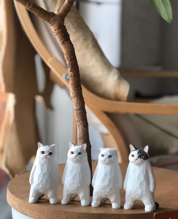 Figures of cats made of wood