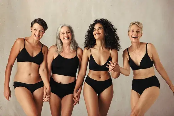 Female models of different ages celebrating natural bodies