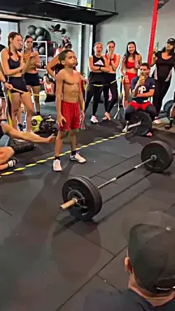 Small boy weight lifting