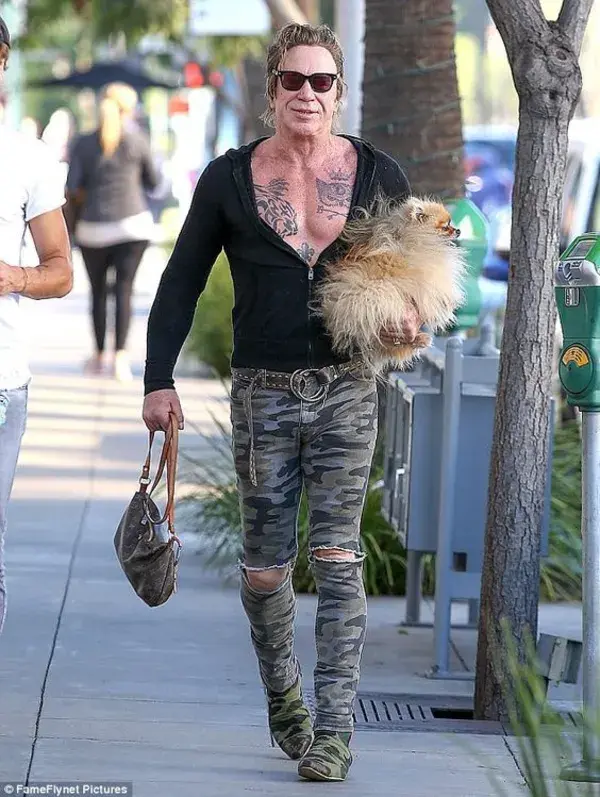 Mickey Rourke wears skintight pants and shows off his brawny chest