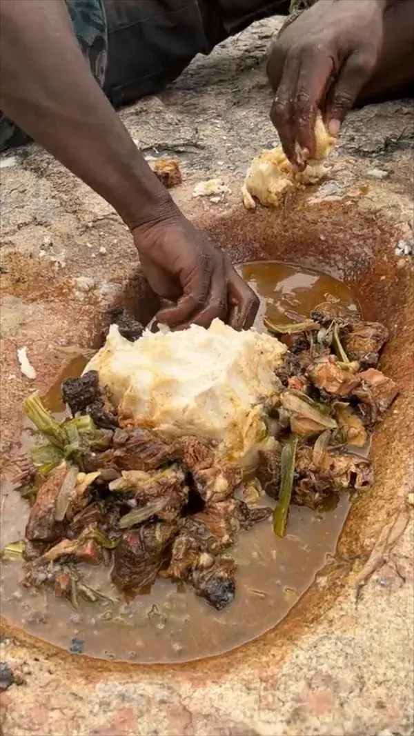 We sit down for a meal with Oscar who shows us how his ancestors traditionally ate fufu 🥩🔥