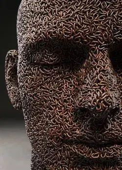 Massive Human Head Sculptures Made of Bicycle Chains Representing Our Modern Tethers