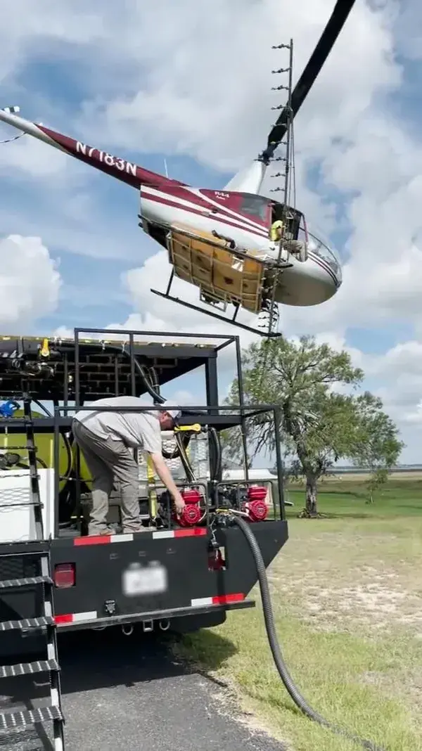 Pilot Lands His Helicopter Neatly Over Truck