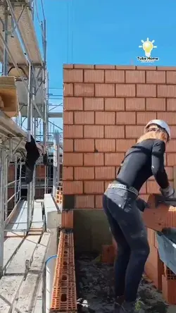 worker fasted making brick wall - tube home