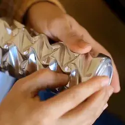 Artist sculpts aluminum cans with his hands