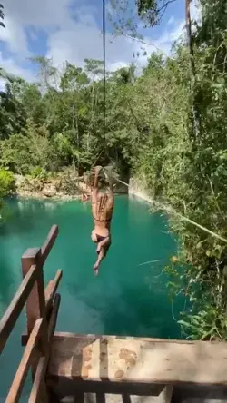 Zip lining into a cenote with in Mexico