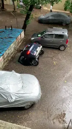 car sinking in sinkhole