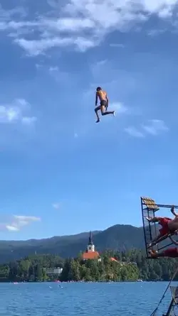 Giant leap into Lake Bled, Slovenia. How high do y’all think he jumped?