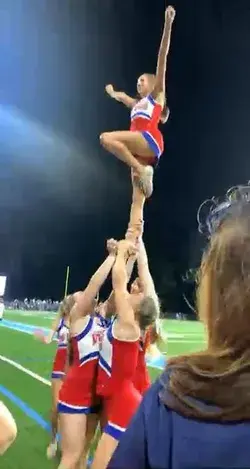 Football side line cheer stunt