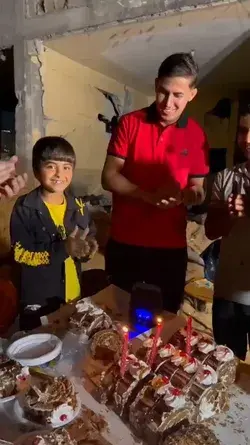 Mustafa (11) celebrates his birthday on the rubble of his destroyed home in Gaza.