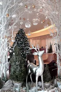 white and silver christmas decor with silver deer