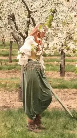 Running carefree in a field of blossoms (with a sword)