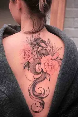 Back Dregon tattoo Flowers #Girlstattoo #Girlbacktattoo #Snecktattoo #Dregontattoo#trendingtattoo