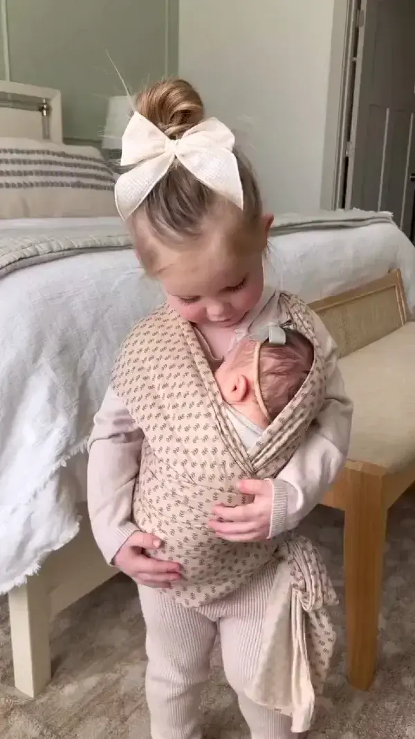 Cute baby and sister