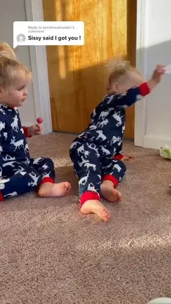 Twin baby girls taking care of each other! So cute!