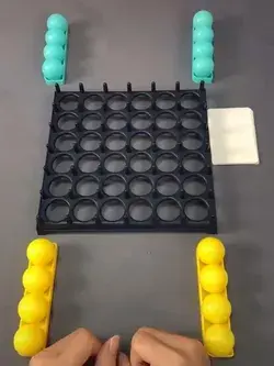 Race to recreate the pattern on the challenge card by bouncing balls into the grid
