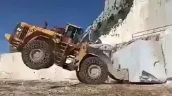 Forklift handling marble. Giant marble.